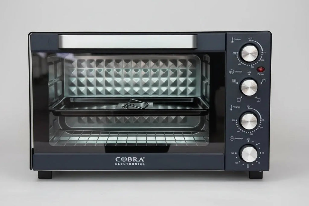 Four électrique cobra 45 litres noir avec porte en verre, boutons de contrôle argentés et grilles intérieures