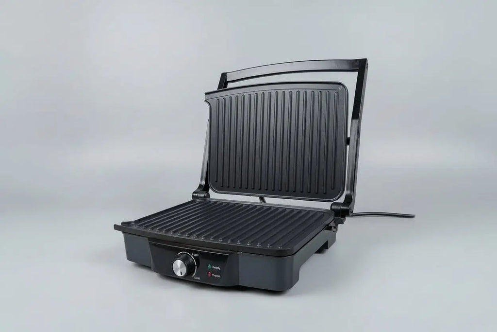 Grille électrique 2000 watt noir avec plaques rainurées et bouton de contrôle en façade pour panini grillé