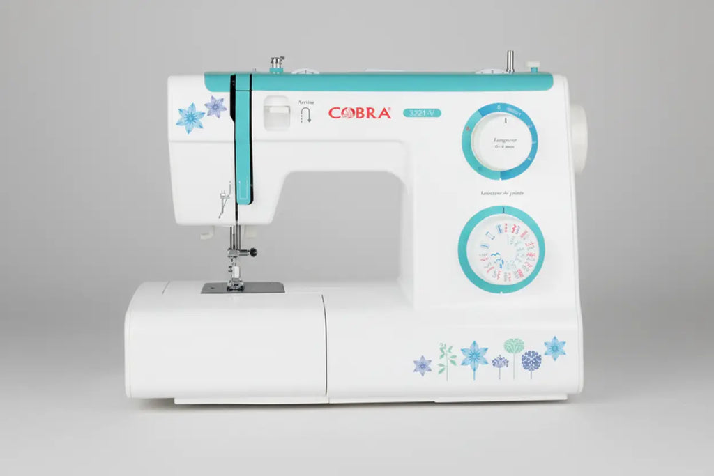 Machine à coudre 3221-v cobra blanc et turquoise avec décors floraux pour couture précise et créative