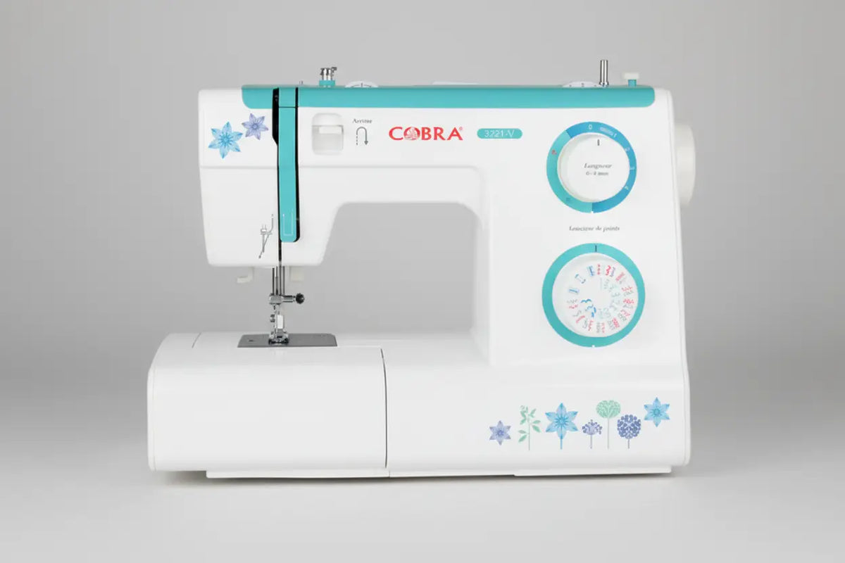 Machine à coudre 3221-v cobra blanc et turquoise avec décors floraux pour couture précise et créative