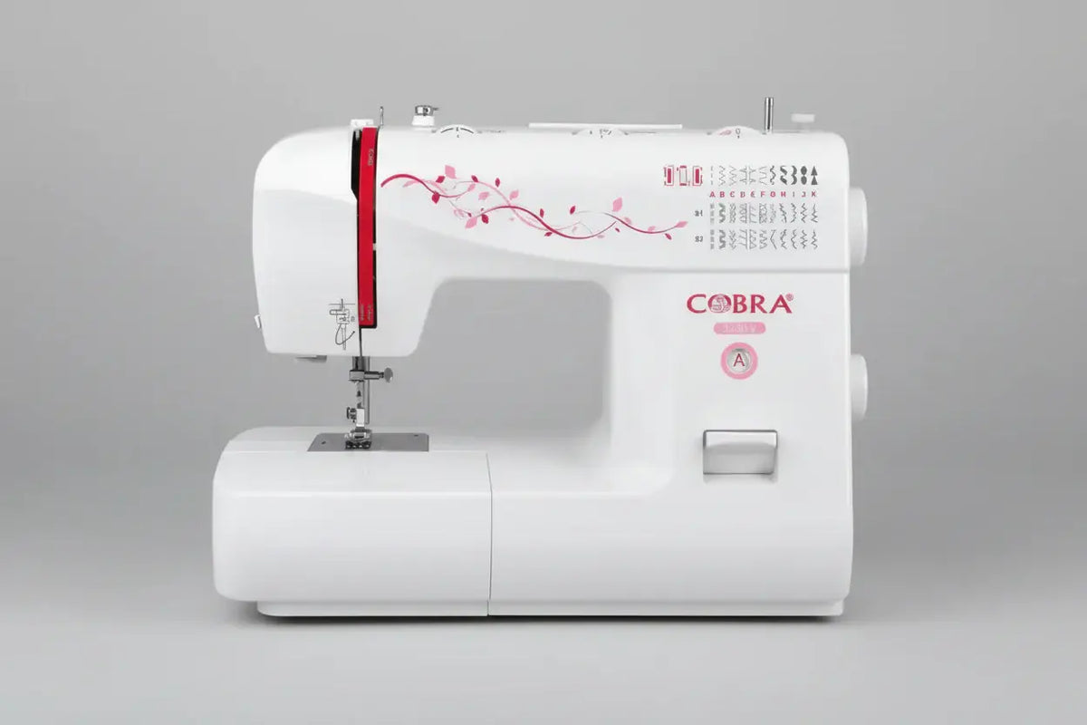 Machine à coudre white cobra 3230-v avec decals floraux roses et accent rouge sur le côté