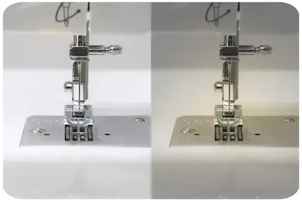 Gros plan du pied presseur métallique et de l’aiguille chromée sur la machine à coudre blanche 3230-V