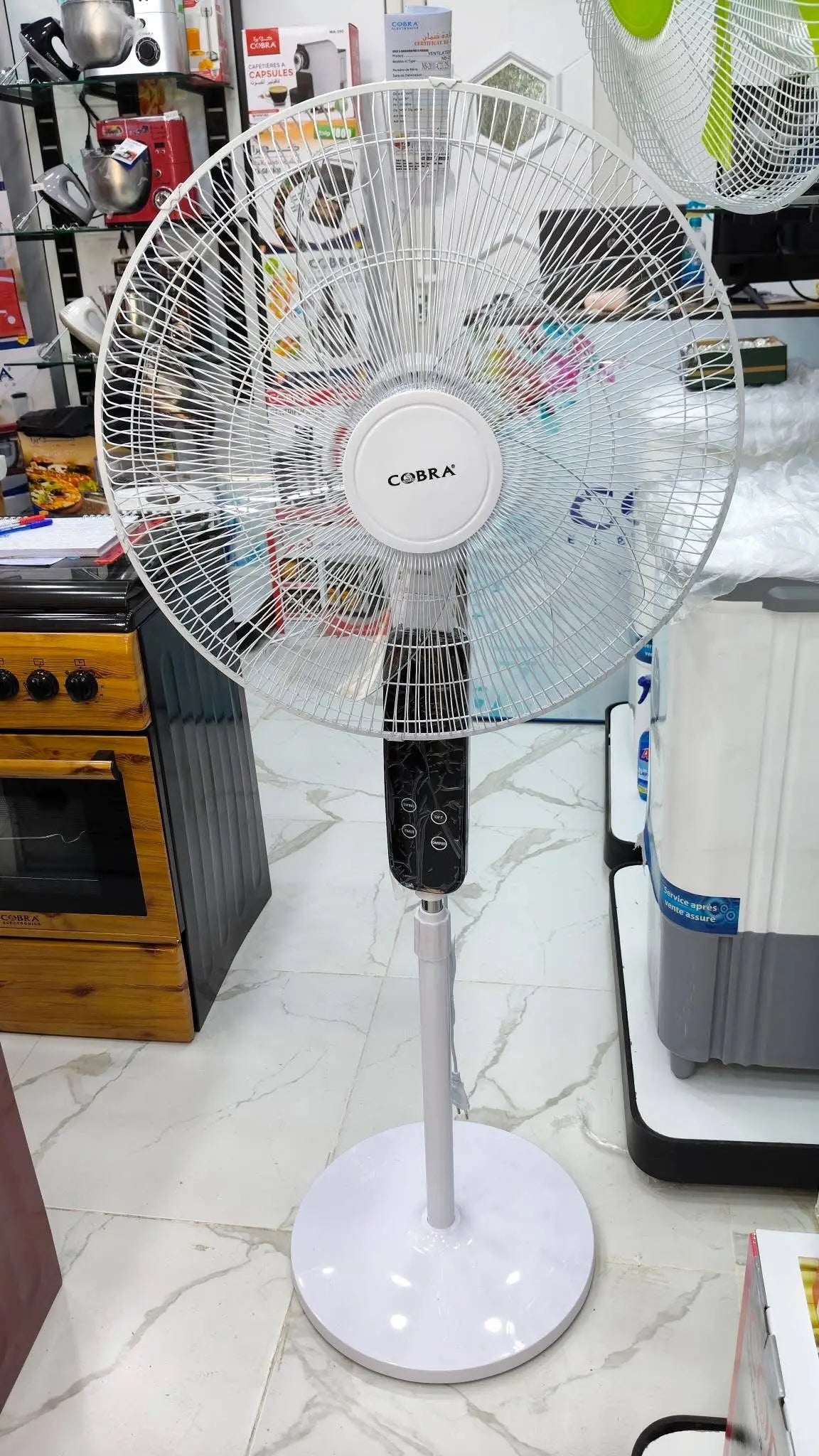 Ventilateur à pieds ns-2011 blanc cobra avec grille métallique circulaire et panneau de commande noir