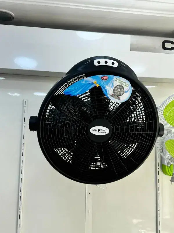 Ventilateur de sol noir nouvelle étoile avec design circulaire et grille de protection en métal
